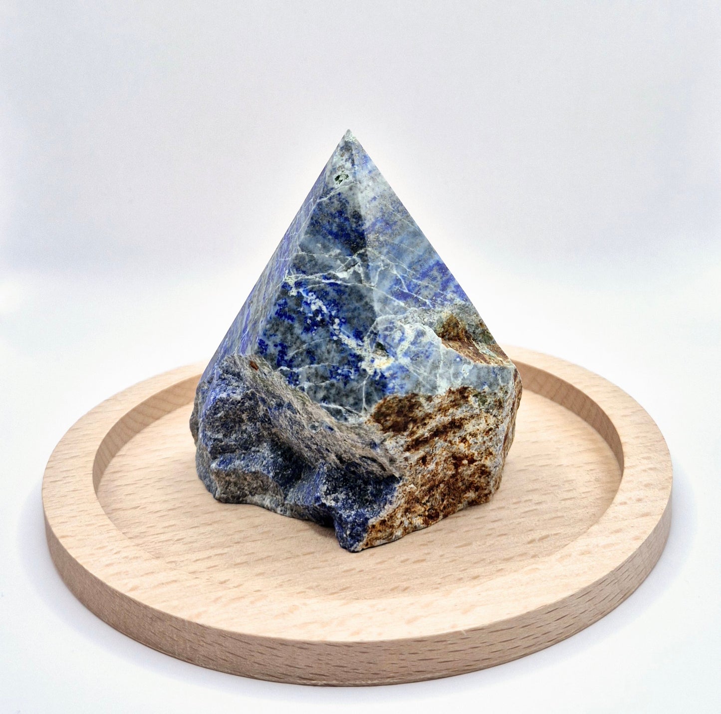 Lapis Lazuli Point (Half Raw, Half Polished)
Unlock your inner wisdom with this Lapis Lazuli Point, blending raw beauty with polished elegance. Lapis Lazuli is a stone of truth and enlightenment, known for enhancing intellectual ability and deepening spiritual insight. The polished top reveals its deep blue hues speckled with golden pyrite, while the raw base keeps its energy grounded and authentic. While Lapis Lazuli can handle brief water contact, it's best to avoid prolonged exposure to protect its deli