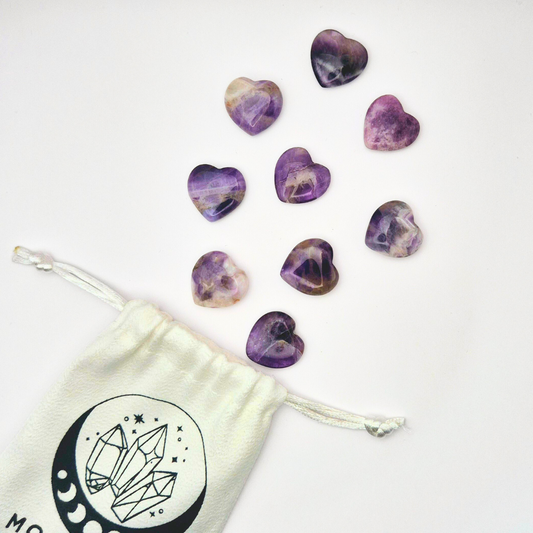 Dream Amethyst Heart Gemstone (3x3 cm) 💜

Hold the magic of Dream Amethyst in the palm of your hand with this beautifully crafted 3x3 cm heart gemstone. Known for its soothing energy and captivating blend of deep purples and calming whites, Dream Amethyst is a powerful stone for enhancing intuition, promoting restful sleep, and bringing balance to your mind and spirit.